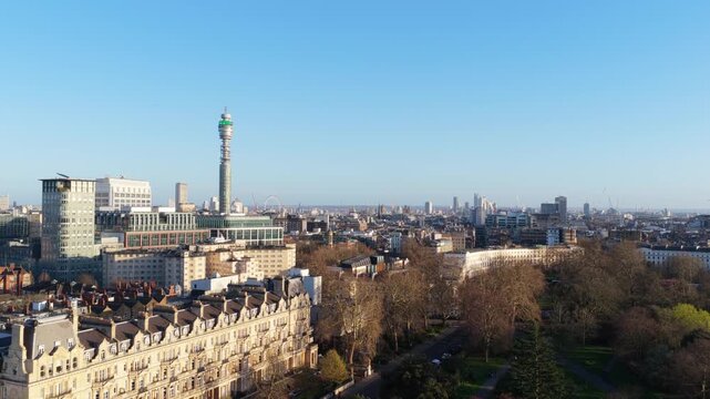 Aerial panorama of London's skyline, showcasing Fitzrovia neighbourhood, Regent's Park, and iconic BT Tower on a clear, sunny day