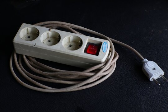 Power strip with multiple sockets and attached extension