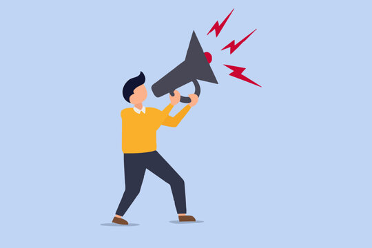 Business man holding a loudspeaker and shouting to make an important announcement.