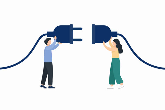 People connecting large electrical plug and socket for partnership concept together.