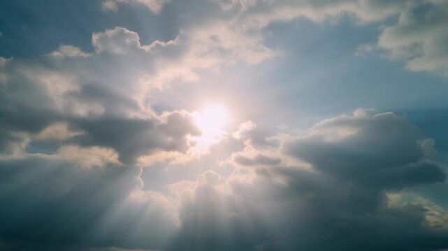 Sun Rays Breaking Through Clouds Dramatic Sky Background Video Still　雲間から差し込む太陽光 ドラマチックな空の背景動画スチル