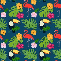 Fototapeta premium Bright tropical seamless pattern with flamingos, toucans, hibiscus flowers and monstera leaves on a blue background. Exotic summer print for textile, wallpaper and packaging design
