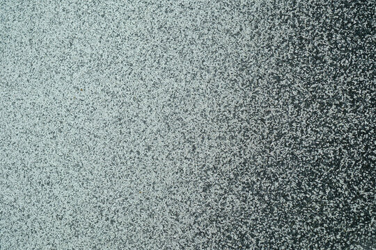 Gray speckled texture with light and shadow