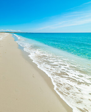 Footprints on White Sand at Mari Ermi Beach Under Blue Sky