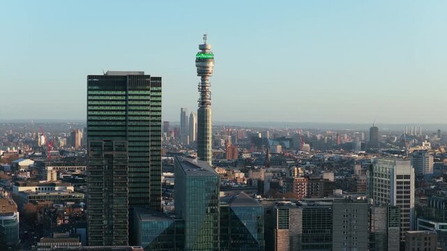 Soaring flight showcasing iconic BT Tower landmark alongside modern Euston Tower, presenting sweeping panorama of London's cityscape and diverse architecture