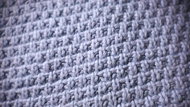 Gray knitted fabric macro texture woven textile background soft cloth material close up fiber pattern abstract fashion detail