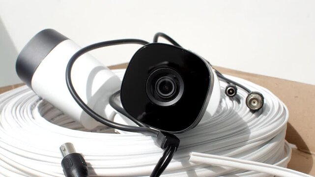 CCTV - Security camera and cable roll ready for installation, ensuring efficient protection.