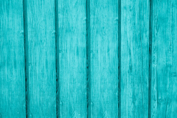 Obraz premium Smooth turquoise wooden planks create a vibrant and inviting background texture