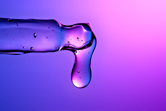 Hyaluronic serum dropping from pipette, beauty skincare technology