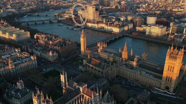 Golden hour illuminating Palace of Westminster, Houses of Parliament, London Eye, Big Ben, Westminster Abbey, and River Thames in historic London city center
