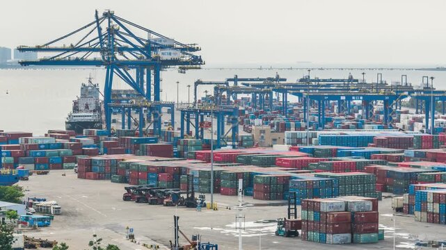 Time-lapse of container terminal at Xiuying Port, Haikou, Hainan Free Trade Port, busy seaport shipping and cargo logistics scene