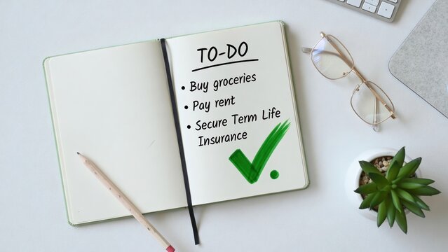 Affordable term life insurance checklist home office to-do list organized environment top-down view planning for peace of mind