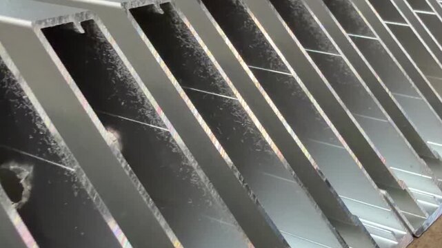 Industrial elegance: aluminium profiles with a polished finish, suitable for promotional brochures.