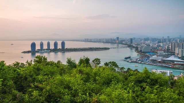 Day to night time-lapse of Luhuitou and Phoenix Island, Sanya, Hainan, China