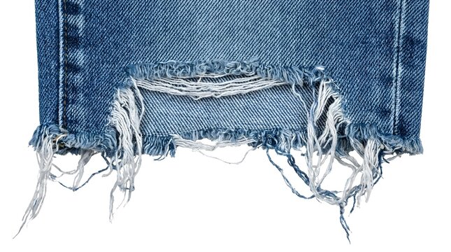 Torn denim jeans with frayed edges.