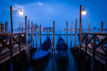 gondolas are parked at venetian canal, italy © jon_chica
