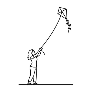 Woman flying a kite outdoors.