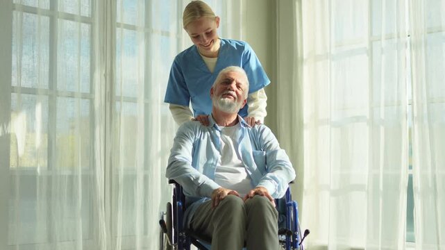 Help support retirement healthcare. Nurse helping old man in wheelchair. Patient and woman in nursing home for medical caregiver. Nurse taking care of paralyzed man in chair for people with disability