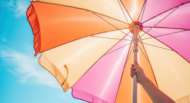 Summer day background with copy space text colorful beach umbrella sky view