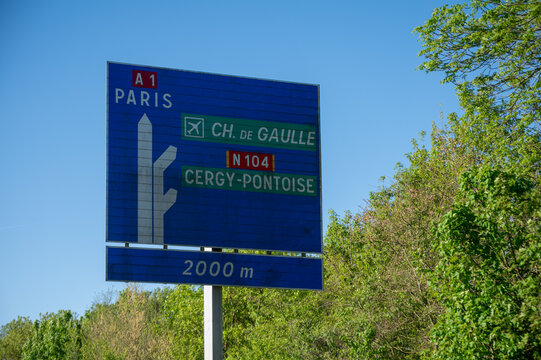 View of a French and European autoroute with overhead directional signs pointing to major cities like Paris, Bordeaux, Lille, Calais, showing lanes, traffic and motorway infrastructure, road signes
