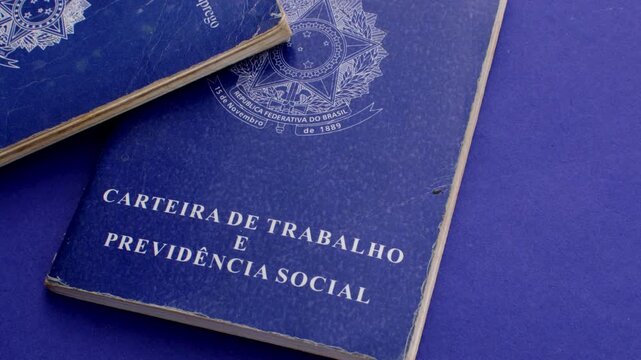 Brazilian work permit on blue surface: professional emblem in stark contrast with the blue background, representing the journey and value of work in Brazil.