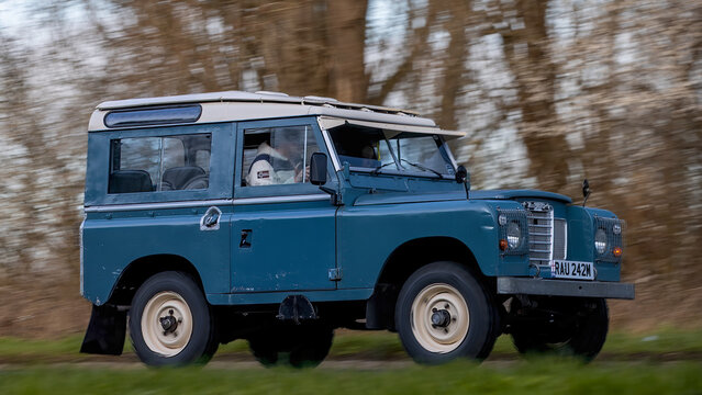 Milton Keynes,Bucks,UK - Mar 1st 2026:1974 blue Land Rover 88 classic  car driving on a British road