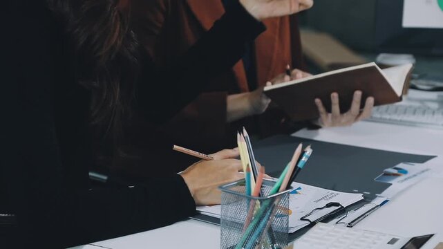 Businessman and Certified Public Accountant (CPA) auditor providing accounting and auditing services in the same company and stock market chart data and anti bribery of accounting