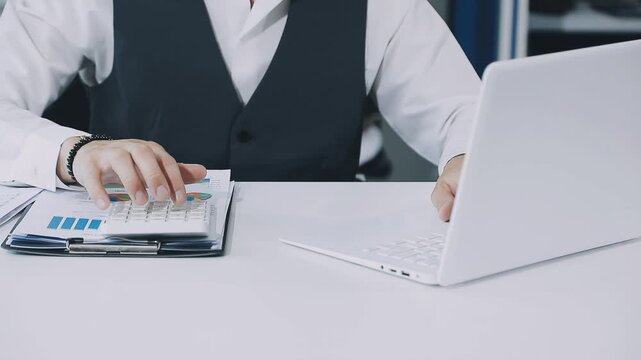 Businessman and Certified Public Accountant (CPA) auditor providing accounting and auditing services in the same company and stock market chart data and anti bribery of accounting