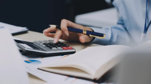 Businessman and Certified Public Accountant (CPA) auditor providing accounting and auditing services in the same company and stock market chart data and anti bribery of accounting
