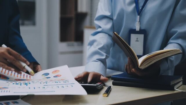 Businessman and Certified Public Accountant (CPA) auditor providing accounting and auditing services in the same company and stock market chart data and anti bribery of accounting
