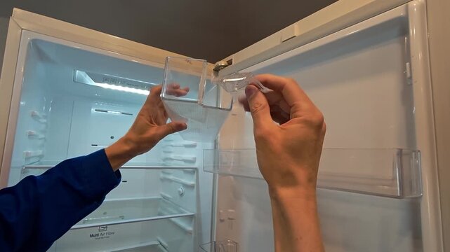 Fixing a broken fridge shelf step by step in a home kitchen