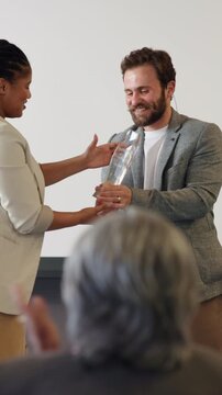 Business people, ceremony or award with handshake for congratulations or company promotion. Businessman, employees or colleagues clapping with smile for trophy, winning or work nomination in seminar