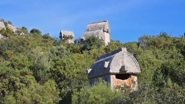 Ancient Lycian tombs on a hillside in Kekova, Turkey