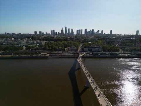 Warszawa - Polska - panorama Warszawy wykonana dronem. Rzeka Wisła, kości&oacute;ł, wieżowce, bloki, ulice w słoneczny dzień