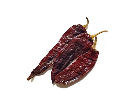 Three dried guaque chili peppers guatemalan traditional spice isolated on white background