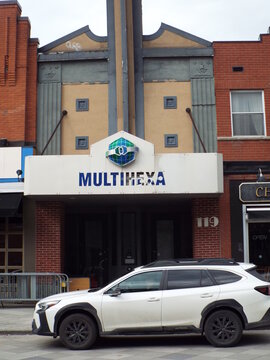 Gatineau, Quebec, Canada &ndash; March 10, 2026: The storefront of "MULTI HEXA" building, which features tan walls and red brick exterior pillars at 930 Rue Jacques-Cartier E.