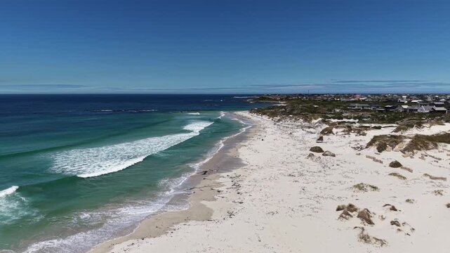 White sandy beach at Betty&rsquo;s Bay, South Africa, captured by drone from above, vivid summer colors, empty coastline, wide horizon, fresh air, calm atmosphere and sense of freedom.