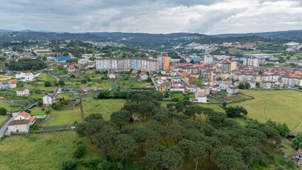 Fototapeta premium Ourense cityscape blending with rural green landscape
