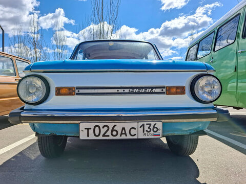 VORONEZH, Russia - April 25, 2026.Classic blue and white Zaporozhets ZAZ parked at retro vehicle exhibition under cloudy sky