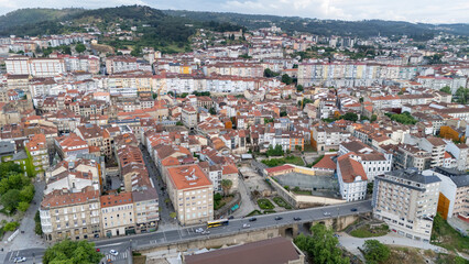 Fototapeta premium Ourense cityscape featuring urban architecture and street traffic
