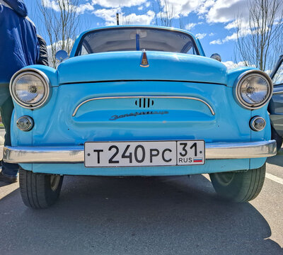 VORONEZH, Russia - April 25, 2026.Detailed view of ZAZ bonnet emblem and Zaporozhets script on blue Soviet era car under bright sky