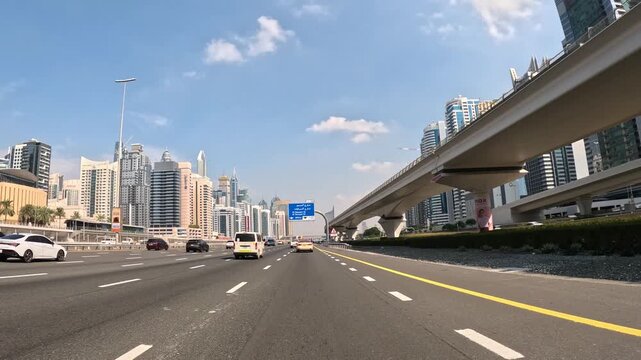 Driving on Sheikh Zayed Road past Dubai Marina skyscrapers, United Arab Emirates