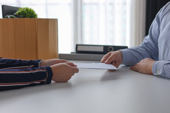 Manager Terminating Employee and Handing Over Severance Document.
