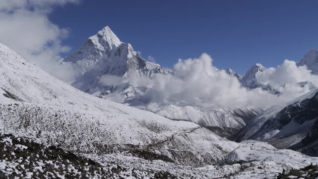 Panoramic view of Himalayan mountains with Ama Dablam Peak Above Clouds, Nepal