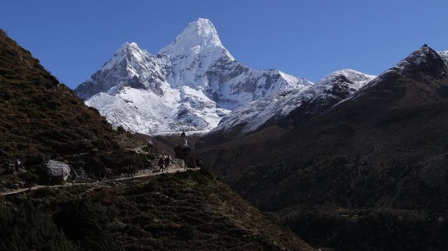 Trekkers on Everest Base Camp trail with Ama Dablam in the background, Nepal
