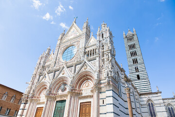 Obraz premium Siena cathedral in Italy. White marbles with blue sky, famous landmark of Tuscany.