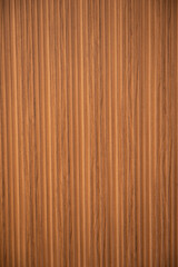 Fototapeta premium Wood panel texture with vertical slats and brown grain