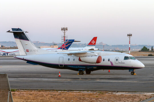 Luqa, Malta -  Jun 1, 2007: Fairchild Dornier 328-300 328JET (Reg.: OE-HTG) parked in apron 9. A very uncommon aircraft as only about 110 were built.
