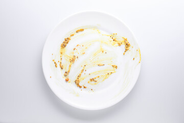 Obraz premium One dirty plate on white background, top view