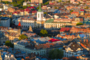 Aerial view of a colorful European city with historic architecture and rooftops © Artem Kniaz